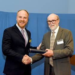 Phil Davidson (representing Charmouth Heritage Coast Centre) receiving the R H Worth Award at the Geological Society's 2019 President's Day.